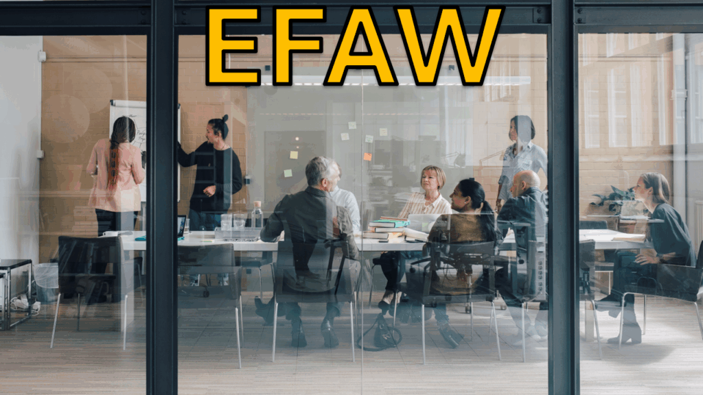picture of 10 adults around a table in an office discussing a project